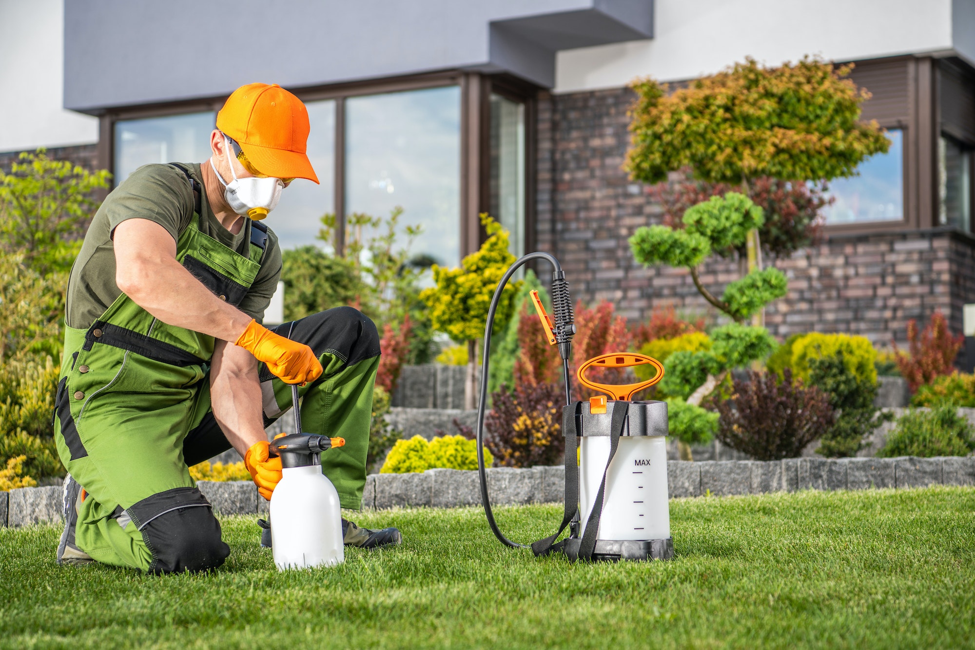 Landscaper Preparing to Perform Pest Control Treatment